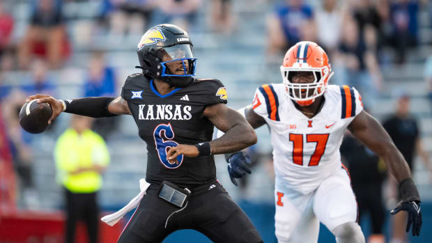 Sep 8, 2023; Lawrence, Kansas, USA; Kansas Jayhawks quarterback Jalon Daniels (6) throws a pass against Illinois Fighting Illini linebacker Gabe Jacas (17) during the first half at David Booth Kansas Memorial Stadium.